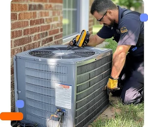 Technician performing routine maintenance on an outdoor air conditioner